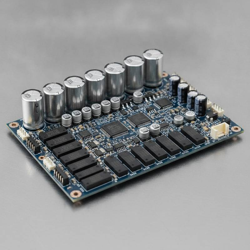 Close up of a custom Battery Management System circuit board with high-quality components